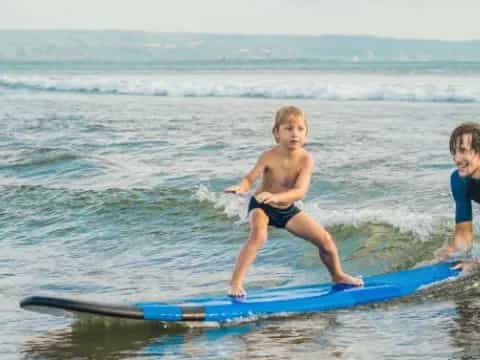kids on surfboards in water