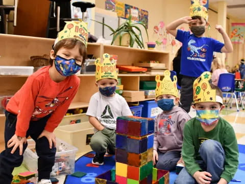 a group of kids wearing party hats