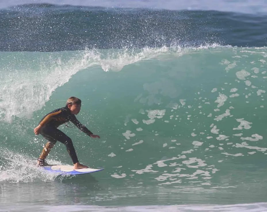 a man surfing on the waves