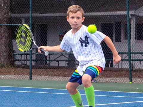 a boy playing tennis