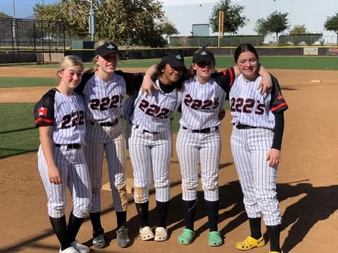 a group of people in sports uniforms