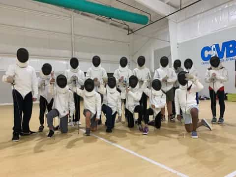 a group of people in white karate uniforms