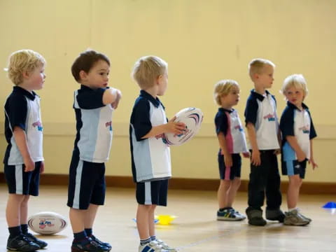 a group of children holding balls