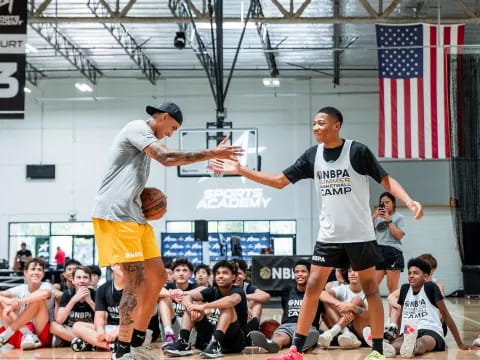 a couple of men playing basketball