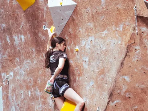 a person climbing a rock wall