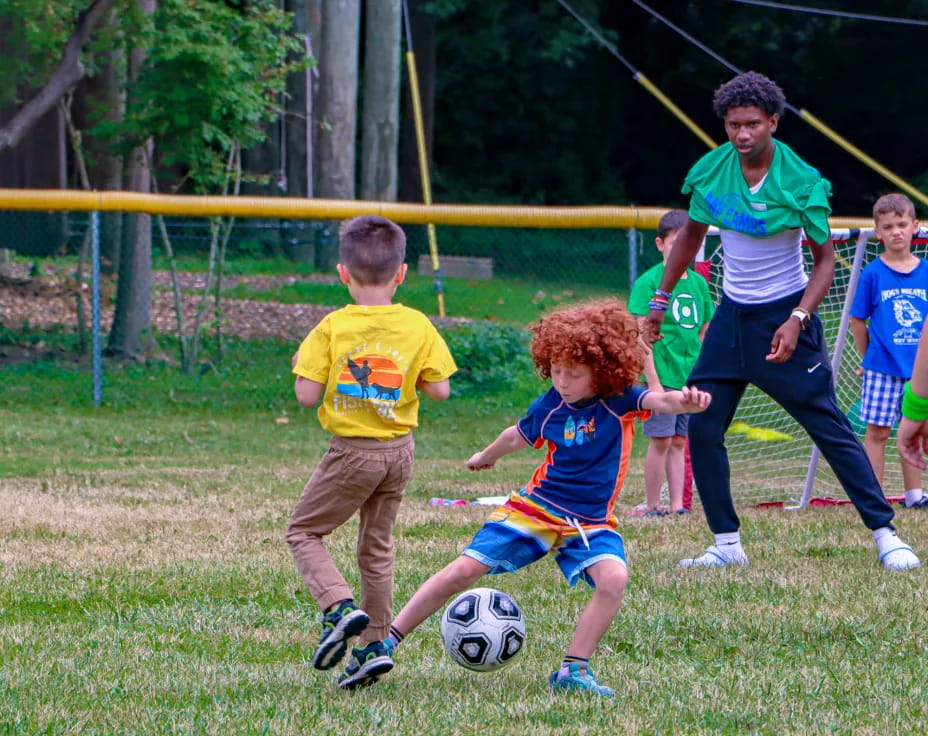 kids playing football on a field