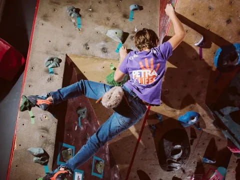 a person climbing a rock wall