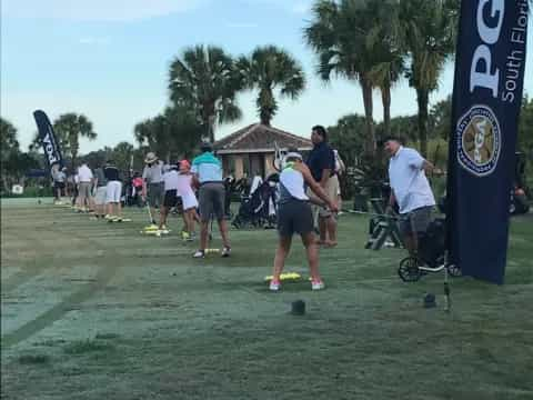 a group of people playing golf