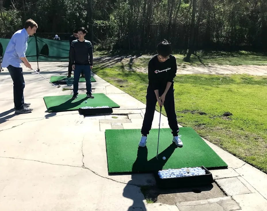 a group of people playing golf