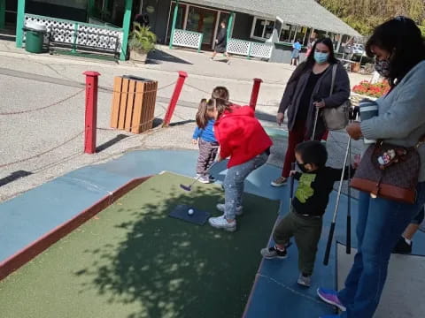 a group of people playing on a playground