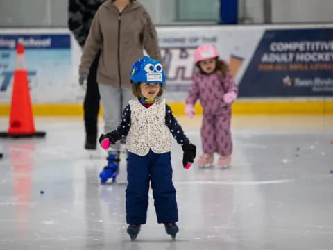 a couple of kids ice skating
