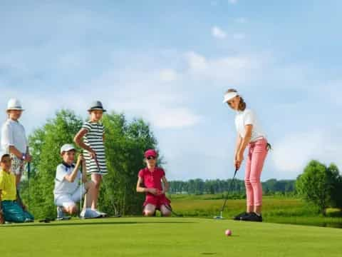 a group of people playing golf