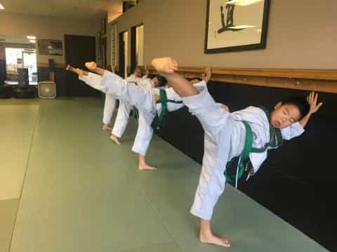 a group of kids practicing karate