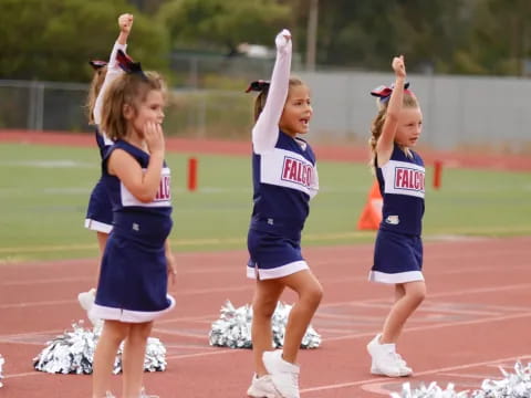 a group of cheerleaders on a track