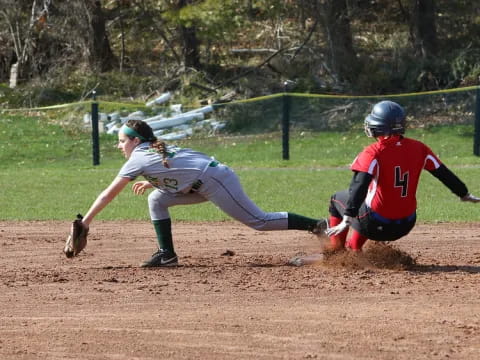 a baseball player sliding into home base