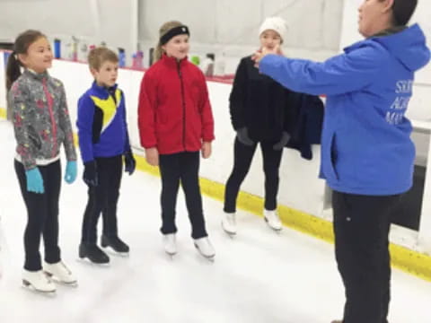 a group of people ice skating