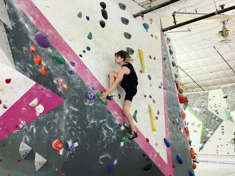 a person climbing a rock wall