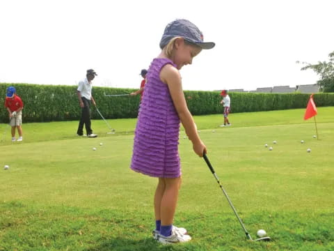 a girl playing golf