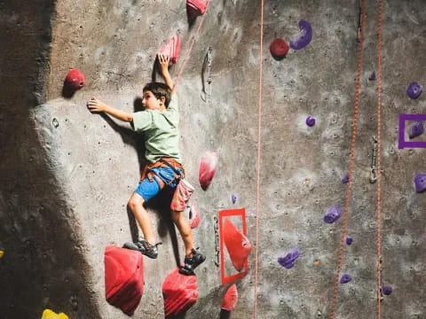 a person climbing a rock wall