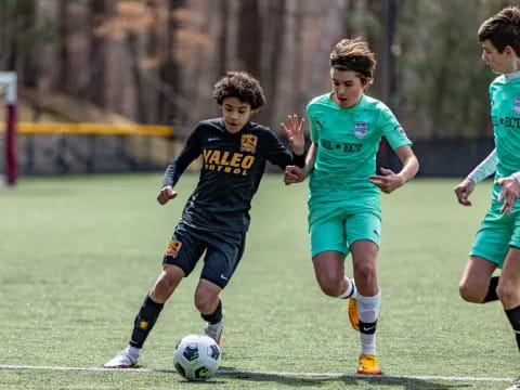 a group of young boys playing football