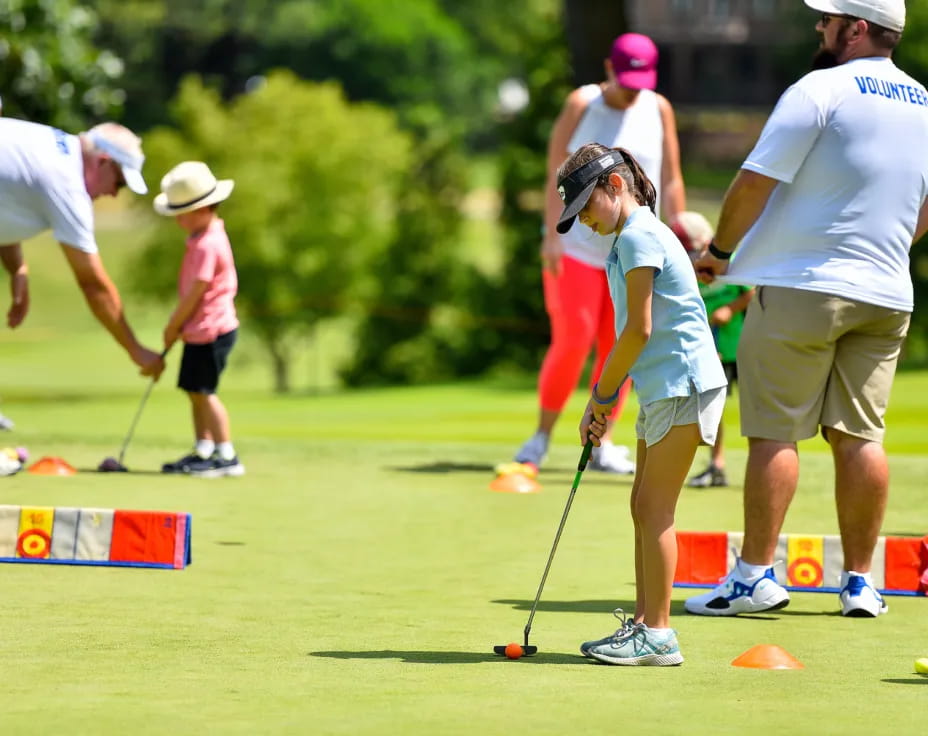 a group of people playing golf