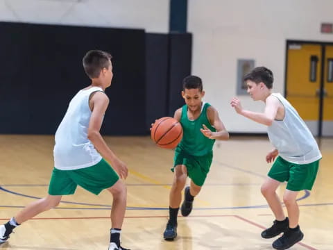 a group of boys playing basketball