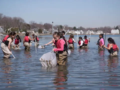 a group of people in a lake