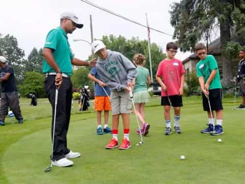 a group of people playing golf