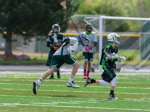 a group of people playing lacrosse