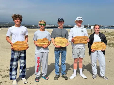 a group of kids holding baseballs