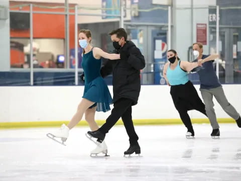 a group of people ice skating