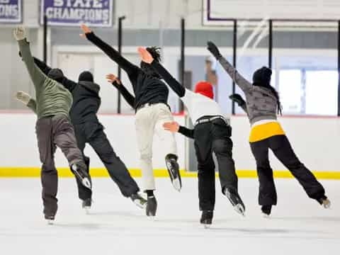 a group of people ice skating