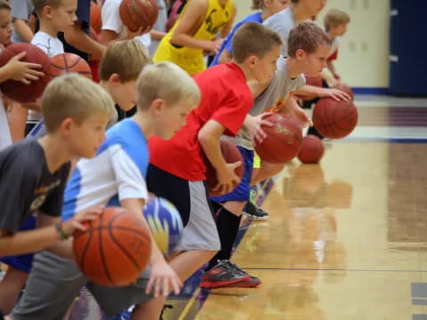 a group of kids playing basketball