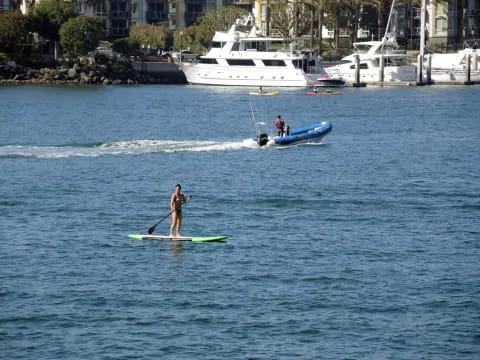 a person paddle boarding in the ocean