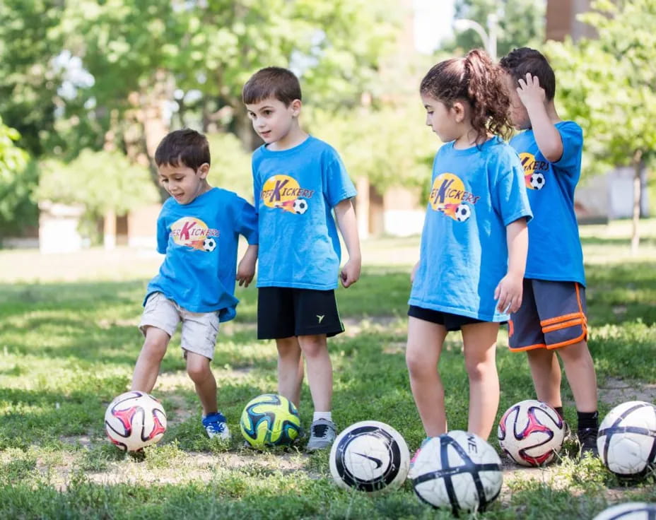 a group of kids playing football