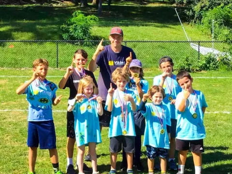 a group of kids posing for a photo