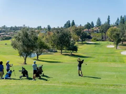 a group of people playing golf