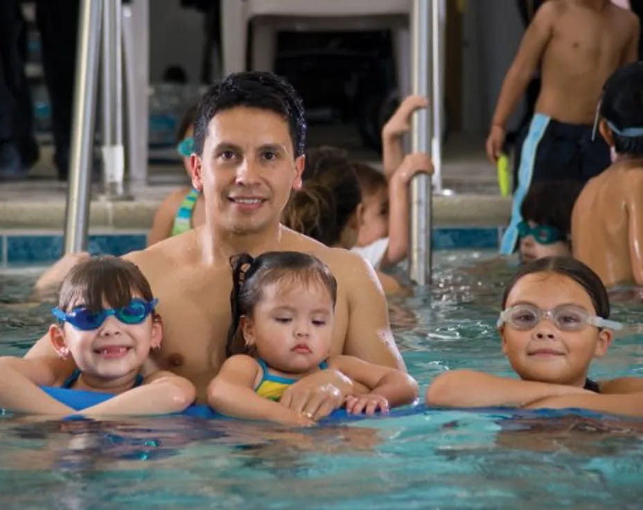 a group of kids in a pool