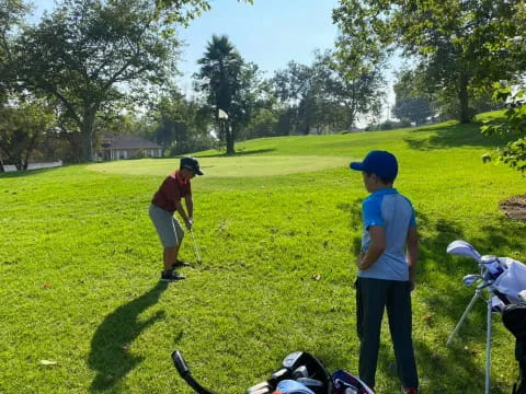 a couple of men playing golf