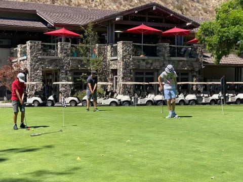 a group of people playing golf