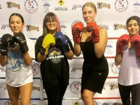 a group of people wearing boxing gloves