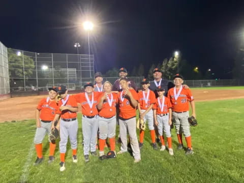 a group of baseball players posing for a photo