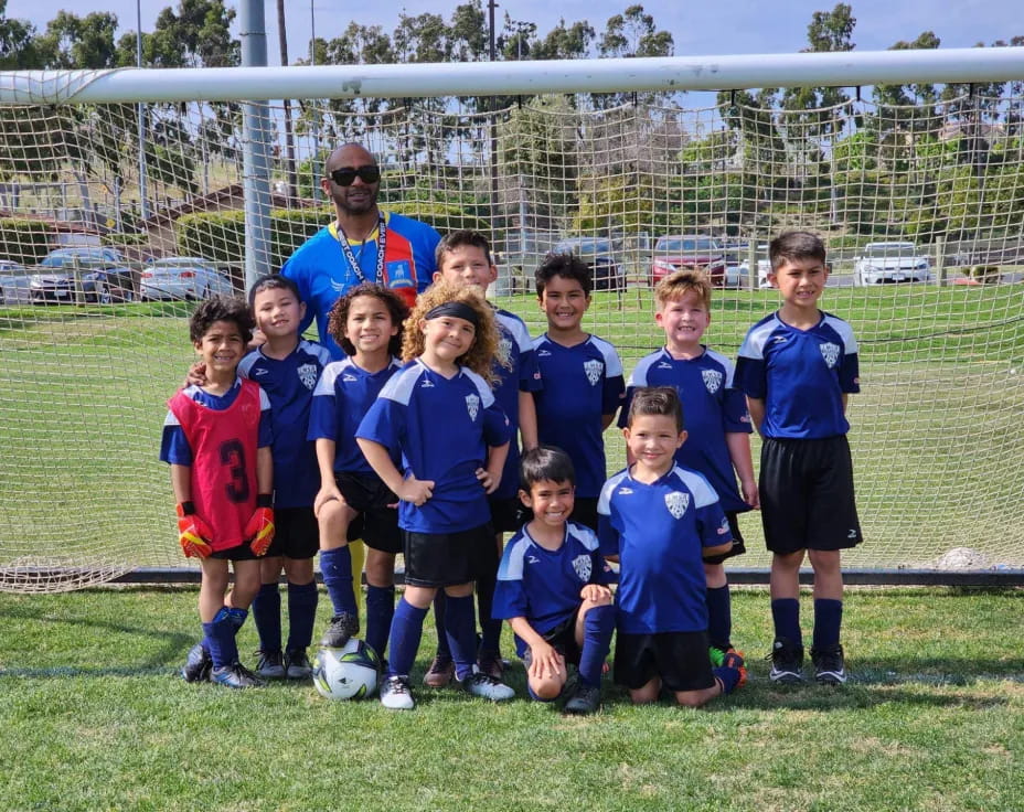 a group of kids posing for a picture