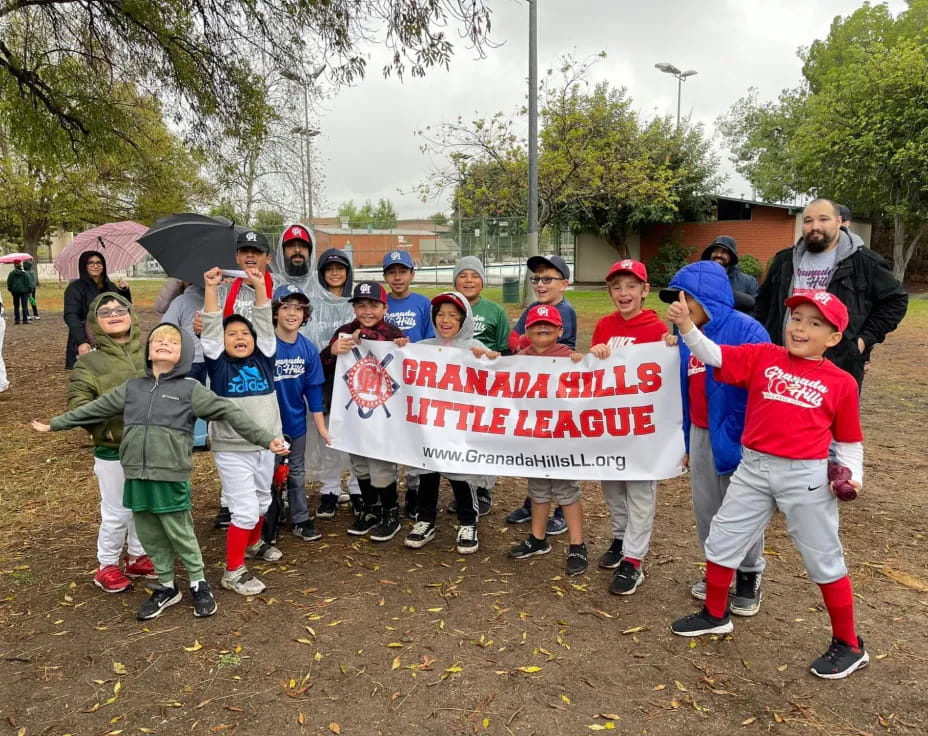 a group of people holding a sign