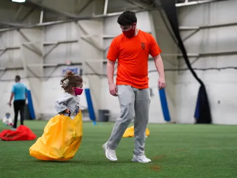 a man and a woman playing baseball