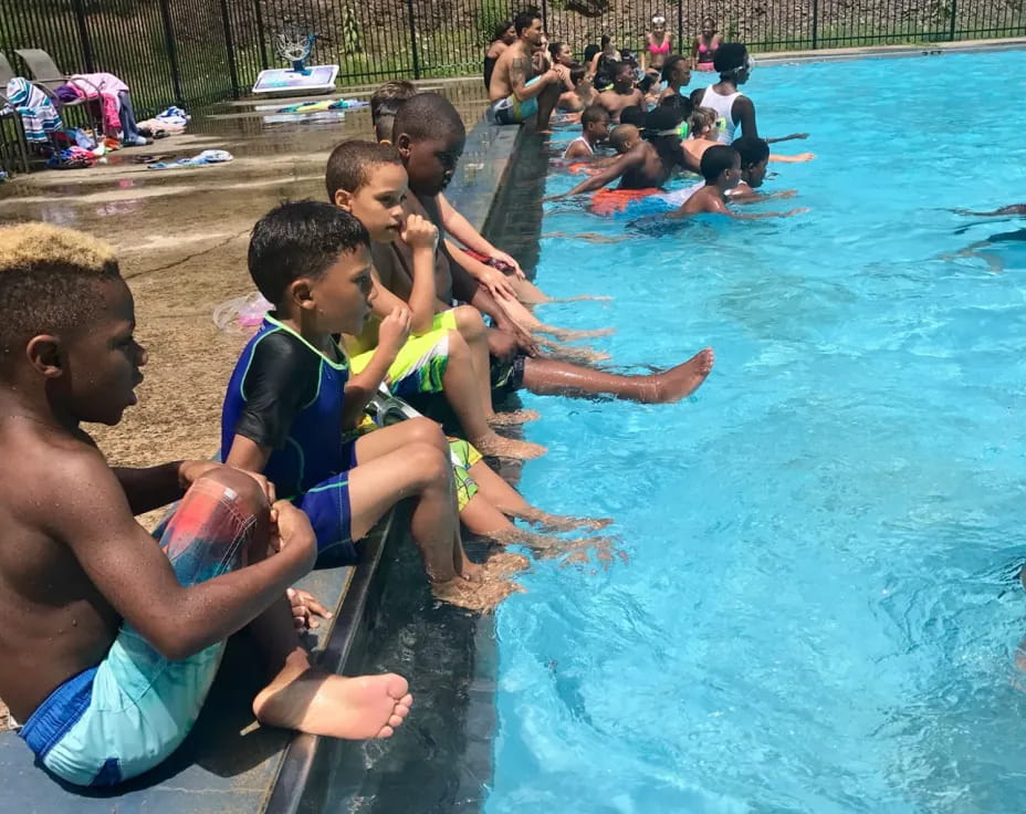 a group of people in a pool