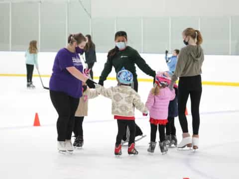 a group of people on ice skates