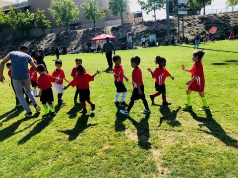 a group of kids playing football