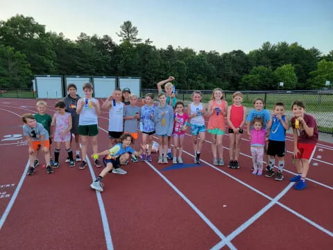 a group of children on a track
