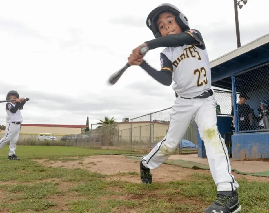 a baseball player swinging a bat